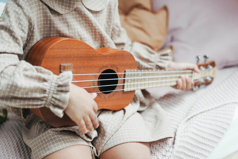 Child Playing Ukulele