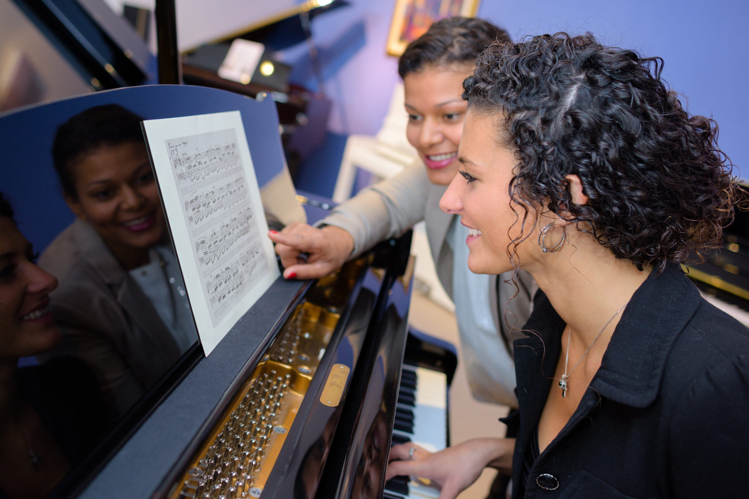 Lady having piano lesson